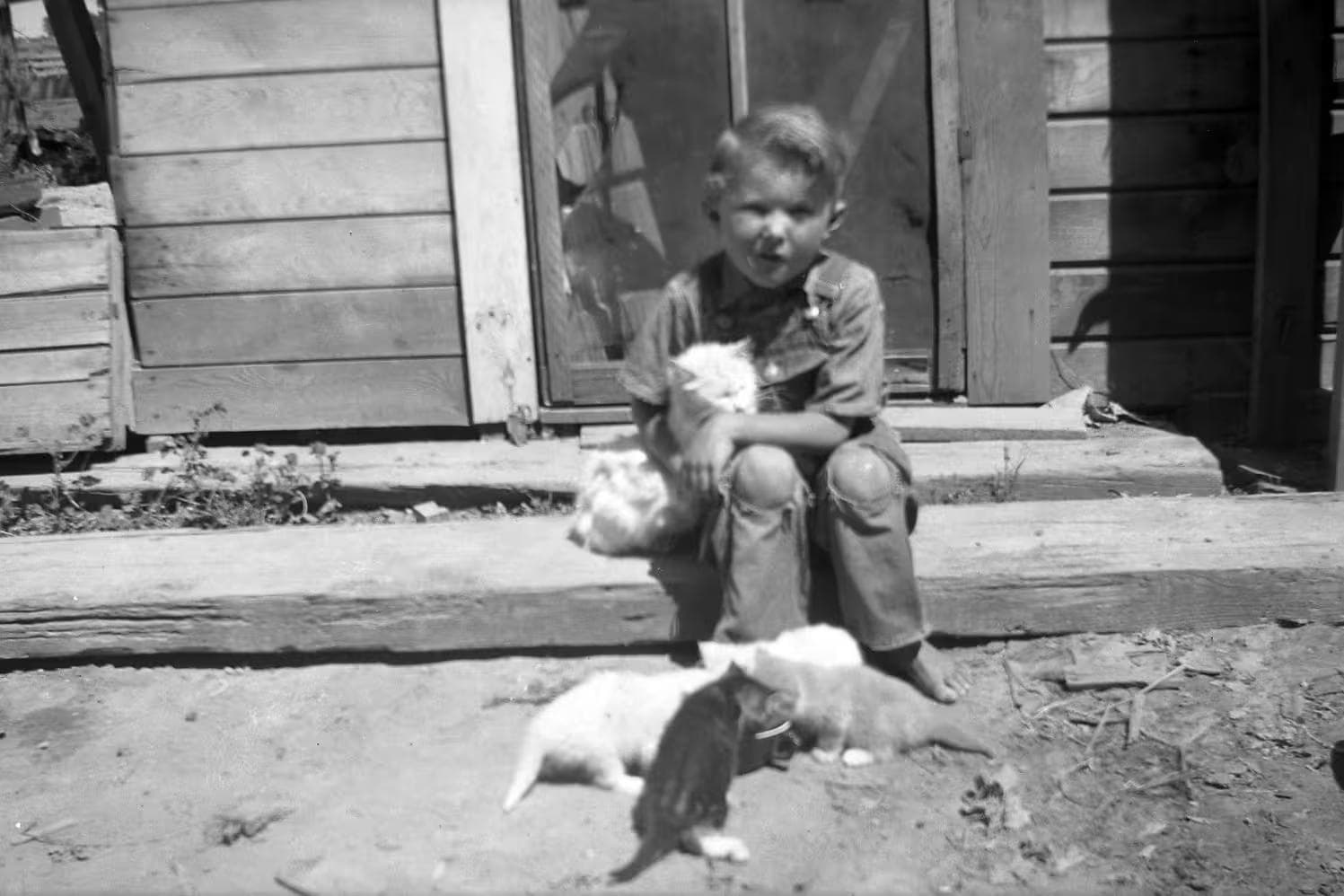 George on steps of original house